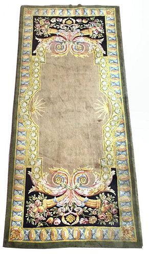 A Savonnerie style green ground rug, 345 x 147cm (135 x 57in) <br. <br>Good colours and good levels