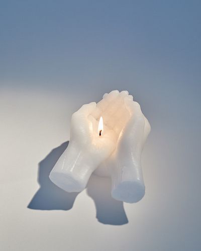 Thais Mather, INTO THE BLACK (CUPPED HANDS), 2021, bee's wax and soy wax candles cast from the artist's arms and hands,5 x 5 x 6 in, 12.7 x 12.7 x 15.