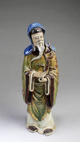 A Porcelain Deity Statue