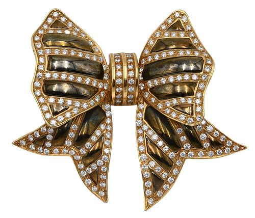 18 Karat Gold Bow Brooch, having enameling set with 202 round cut diamonds, height 2 1/2 inches, width 2 3/4 inches, 44.9 grams.
