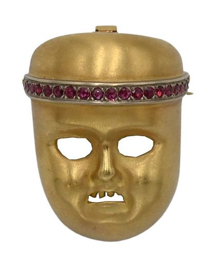 Kieselstein-Cord 18 Karat Gold Mask, having line of 19 rubies, height 1 3/8 inches, 27 grams.