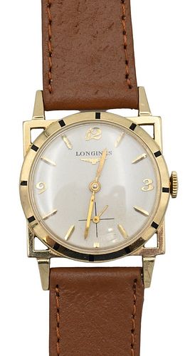 Longines 14 Karat Gold Mens Wristwatch, having open work square around round dial, 28.5 millimeters.