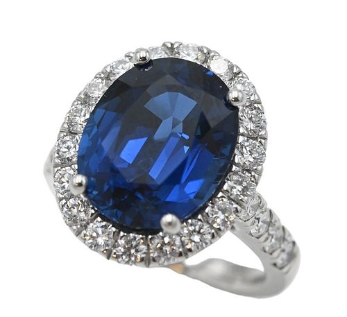 Platinum Ring Set with Oval Mixed Cut Blue Sapphire, 9.37 carats, surrounded by 18 round brilliant cut diamond, along with an A.G.L. report, size 6.
