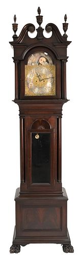 Waltham Mahogany Tall Case Clock, having three finial top with broken arch, Elliot works with moon phases, along with triple brass weights set on paw 
