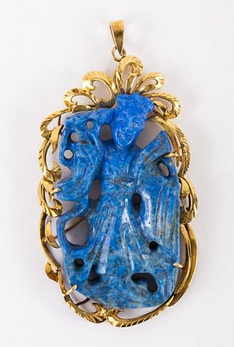 A Gold Lapis Carved Pendant