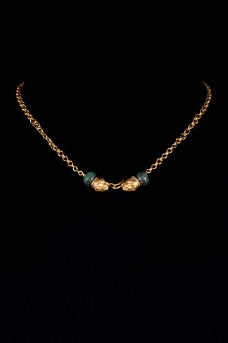 A GOLD NECKLACE WITH GREEK HELLENISTIC LION HEAD TERMINALS
CIRCA 400 BC.