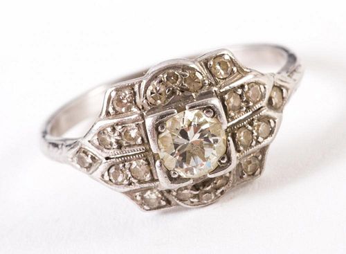 An 18 Karat White Gold Diamond Filigree Ring