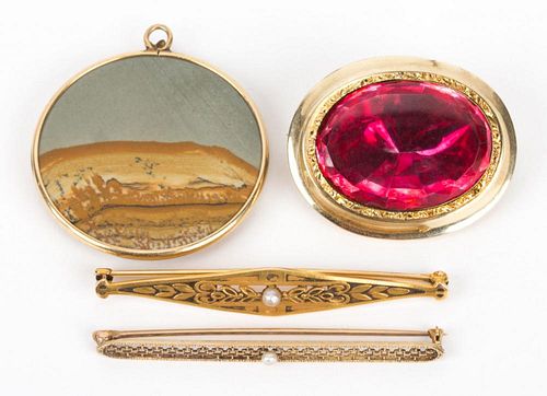 A Collection of Gold Pendants and Pins