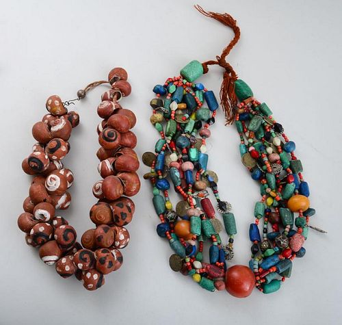 AFRICAN PAINTED SHELL NECKLACE AND AN ISLAMIC COIN-MOUNTED POLYCHROME BEAD NECKLACE