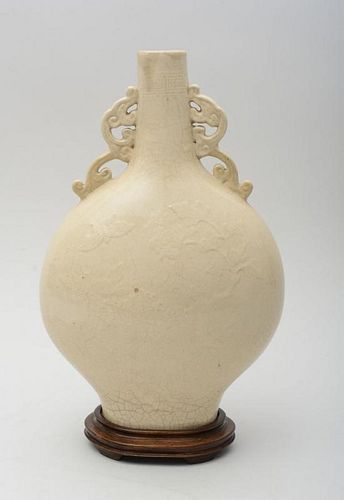 CHINESE MING TYPE IVORY GLAZED AND RELIEF DECORATED PORCELAIN MOON VASE