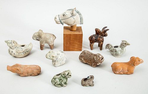 GROUP OF TEN POTTERY AND PORCELAIN ANIMAL FIGURES AND A GLAZED POTTERY HORSEHEAD