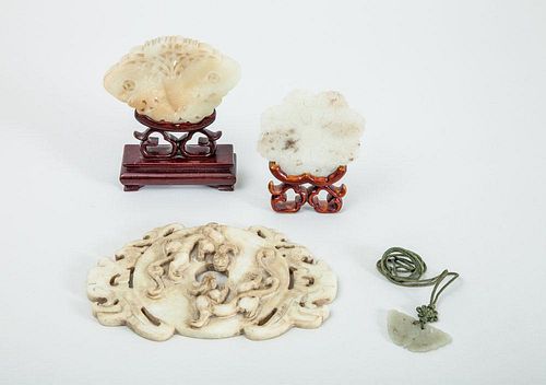 GROUP OF FOUR CHINESE CARVED JADE PENDANTS