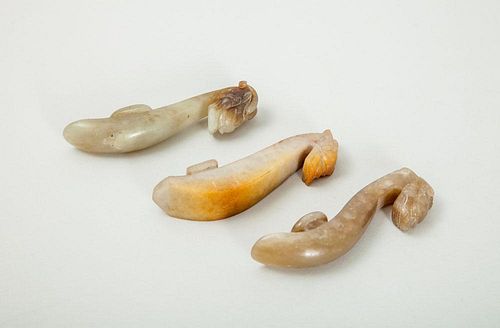THREE CHINESE CARVED JADE BUCKLES