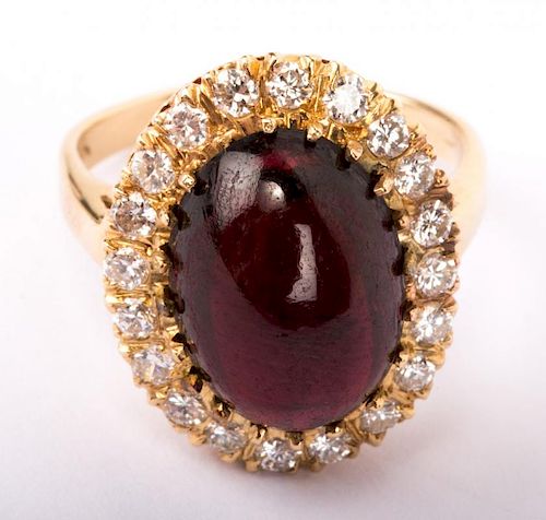 A Cabochon Garnet and Diamond Ring