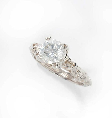 A Diamond & Eighteen Karat White Gold Ring