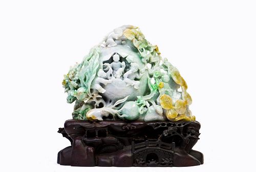 A CHINESE JADEITE CARVED WITH POMEGRANATE AND KIDS