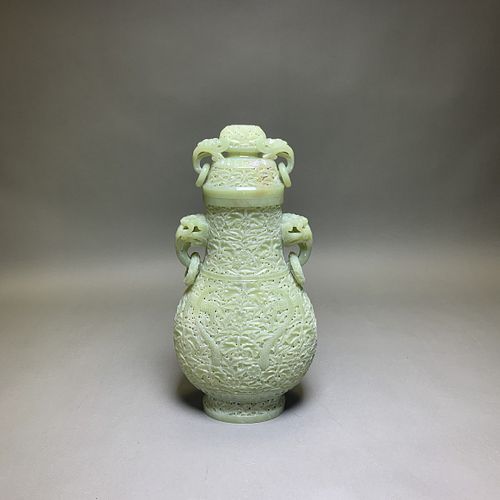 A CARVED CELADON WHITE JADE VASE AND COVER 