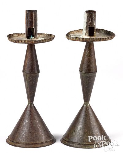 Pair of weighted tin candlesticks, 19th c.