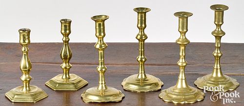 Three pairs of English Queen Anne candlesticks