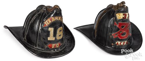 Two painted leather fire helmets, 19th c.