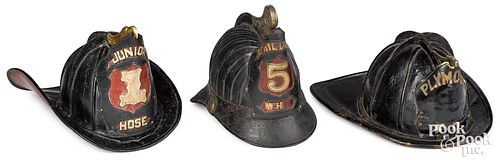Three painted leather fire helmets, 19th c.