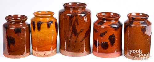 Five redware crocks, 19th c.