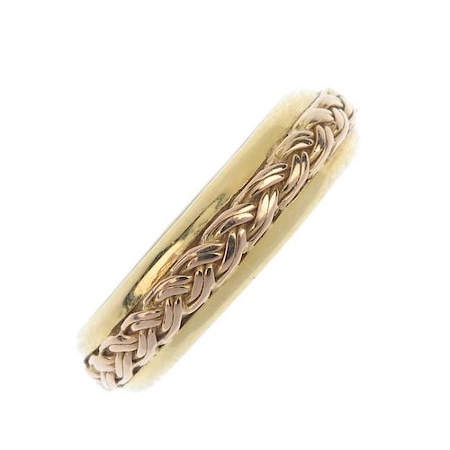 CLOGAU - an 18ct gold band ring. The plain band, with stylised knot motif. Maker's marks for Clogau.