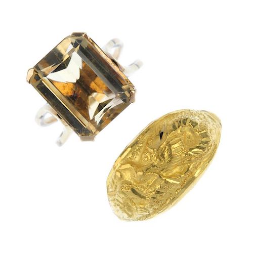 Two dress rings. To include a rectangular-shape citrine single-stone ring with bifurcated band, toge