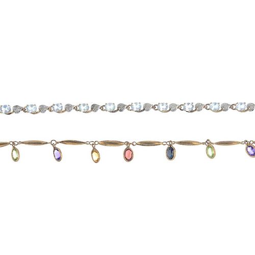 A selection of three gem-set bracelets. To include a blue topaz bracelet with diamond foliate spacer