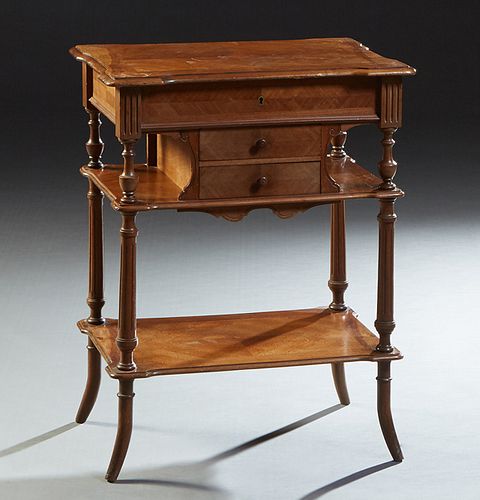 French Carved Mahogany Work Table, 19th c., the shaped lifting lid with an interior beveled mirror and compartmented storage, over two small central d