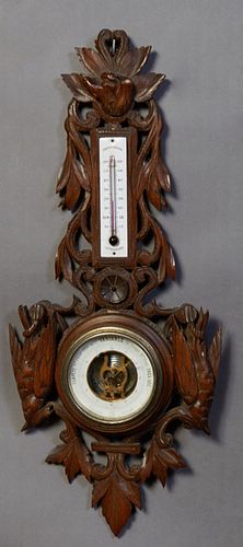 French Carved Walnut Aneroid Barometer, early 20th c., the top with a relief hunting dog carving over an enameled alcohol thermometer above an aneroid