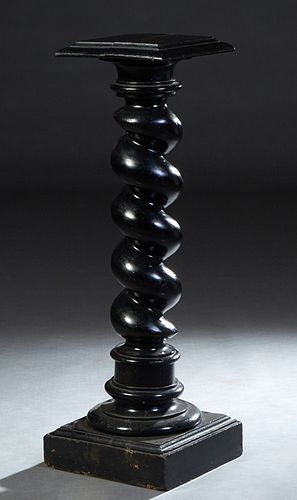 French Provincial Ebonized Carved Beech Pedestal, 19th c., the stepped square top over a twisted support to a circular socle on a stepped square base,