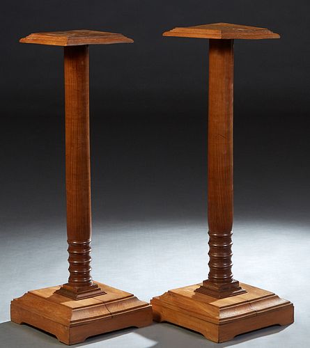 Pair of French Provincial Carved Cherry Pedestals, 20th c., the stepped square top over a turned columnar support, on a square base on bracket feet, H