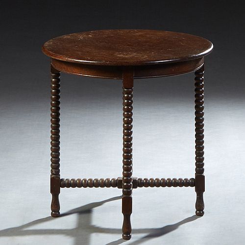 French Provincial Carved Oak Lamp Table, c. 1900, the circular top over a wide skirt, on bobbin turned legs joined by a bobbin turned stretcher, H.- 2