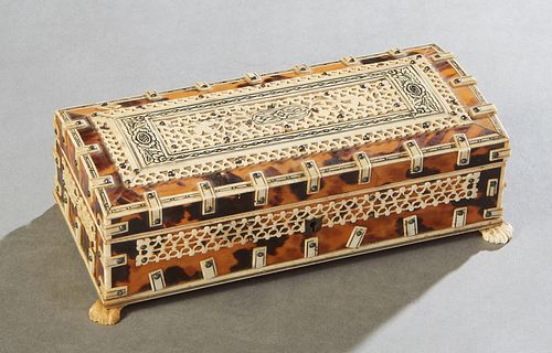 Anglo-Indian Tortoise Shell and Bone Dresser Box, early 20th c., the arched top with pierced bone decoration, over sides with like decoration, on paw 