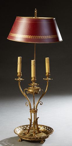 French Style Tole and Bronze Bouillotte Lamp, 20th c., the adjustable magenta and gilt decorated tole shade on a square support, over three scrolled e