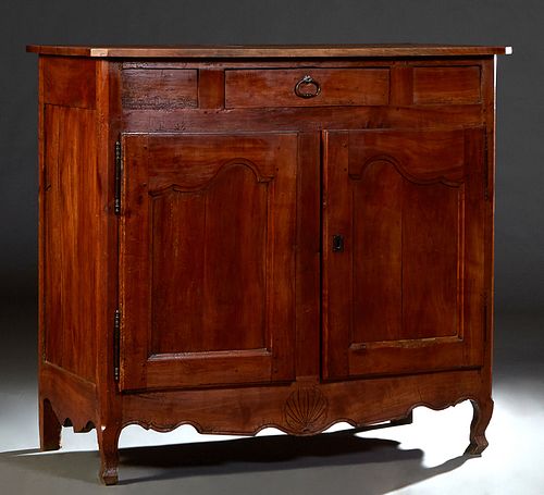 French Provincial Louis XV Style Carved Cherry Sideboard, early 19th c., the canted corner top over a setback central frieze drawer over two large cup