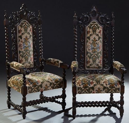 Pair of French Louis XIII Style Carved Oak Fauteuils, c. 1880, the arched pierced dragon carved back with turned finials, over arched upholstered clot