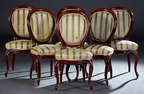Set of Six French Louis XV Style Carved Mahogany Dining Chairs, 19th c., the canted oval cushioned back above a bowfront cushion seat, on cabriole leg