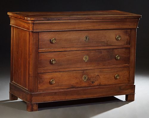 French Provincial Carved Walnut Louis Philippe Commode, 19th c., the curved corner top over a frieze drawer and three setback deep drawers, on a plint