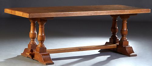French Provincial Carved Oak Monastery Table, 19th c., the 2 1/2 in. thick rectangular top on trestle bases with double turned urn supports, joined by
