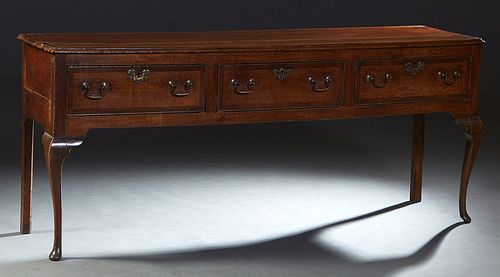 English Queen Anne Style Mahogany and Oak Huntboard, 19th c., the banded ogee rectangular top over three large frieze drawers, on cabriole legs with p