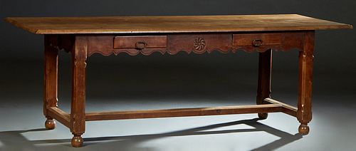 French Provincial Carved Cherry Farmhouse Table, 19th c., stepped rounded rectangular top over a wide scalloped skirt, with two frieze drawers on one 