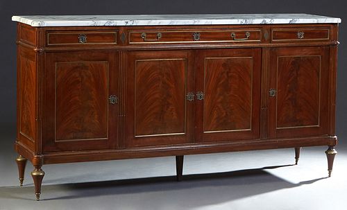 French Carved Mahogany Louis XVI Style Ormolu Mounted Marble Top Sideboard, 20th c., the thick figured ogee edge cookie corner white marble over three