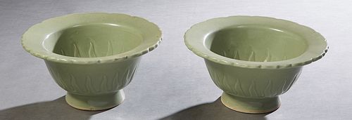 Pair of Oriental Celadon Bowls, with wide scalloped rims over sloping sides with flame decoration on the interior and exterior, the bottom with two ho