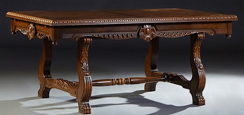 Spanish Renaissance Style Carved Oak Drawleaf Dining Table, 20th c., the gadrooned edge top over a wide scalloped skirt with two draw leaves, on reede