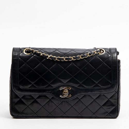 Chanel Paris Double Flap Shoulder Bag, c. 1989, in black quilted lambskin leather with golden and silvered hardware, the interior of the bag lined in 