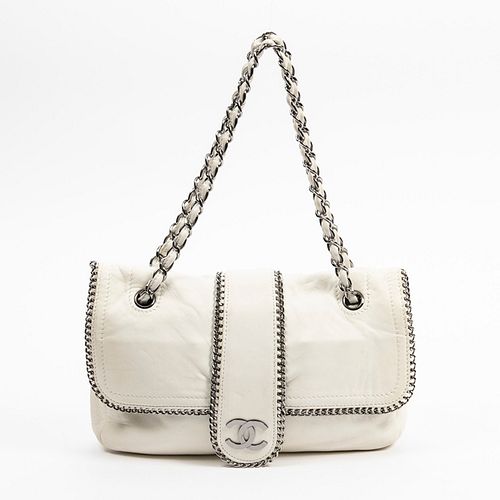 Chanel Madison Flap Shoulder Bag, c. 2006, in white calf leather with silvered hardware, opening to a grey quilted satin lined interior with two side-