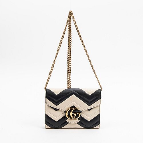 Gucci Matelasse GG Marmont Chain Wallet, in black and ivory calf skin with chevron stitching design and golden brass hardware, opening to a black leat