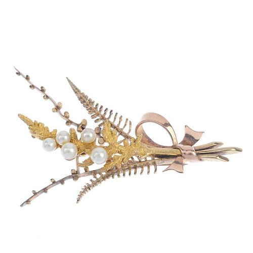 A 9ct gold cultured pearl foliate brooch. Designed as a fern, with cultured pearl accents and bow de